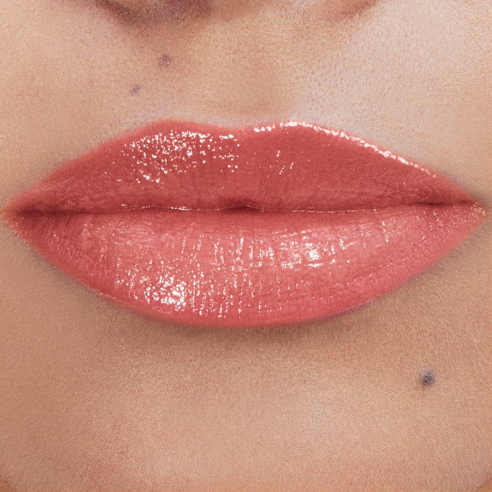 Andrea's lips wearing YSL LOVESHINE Lipstick in shade 214 Wet
Guava, a glossy coral-pink.