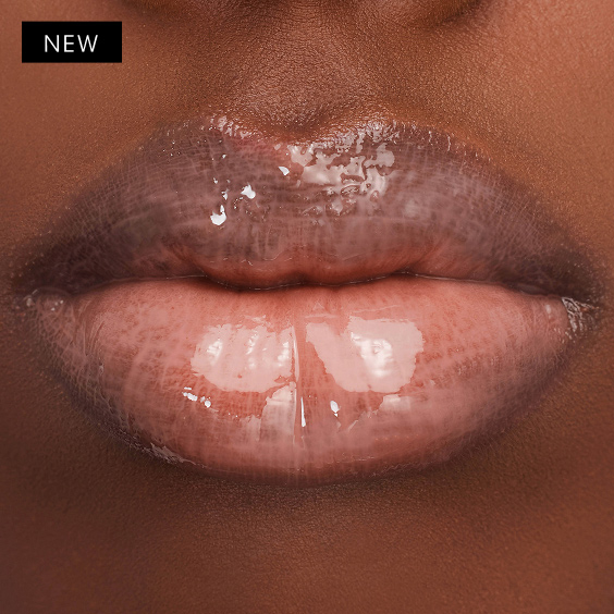 Sarah's deep skintone lips glisten with YSL LOVESHINE Plumping Gloss in shade 1, offering a captivating, high-shine finish.